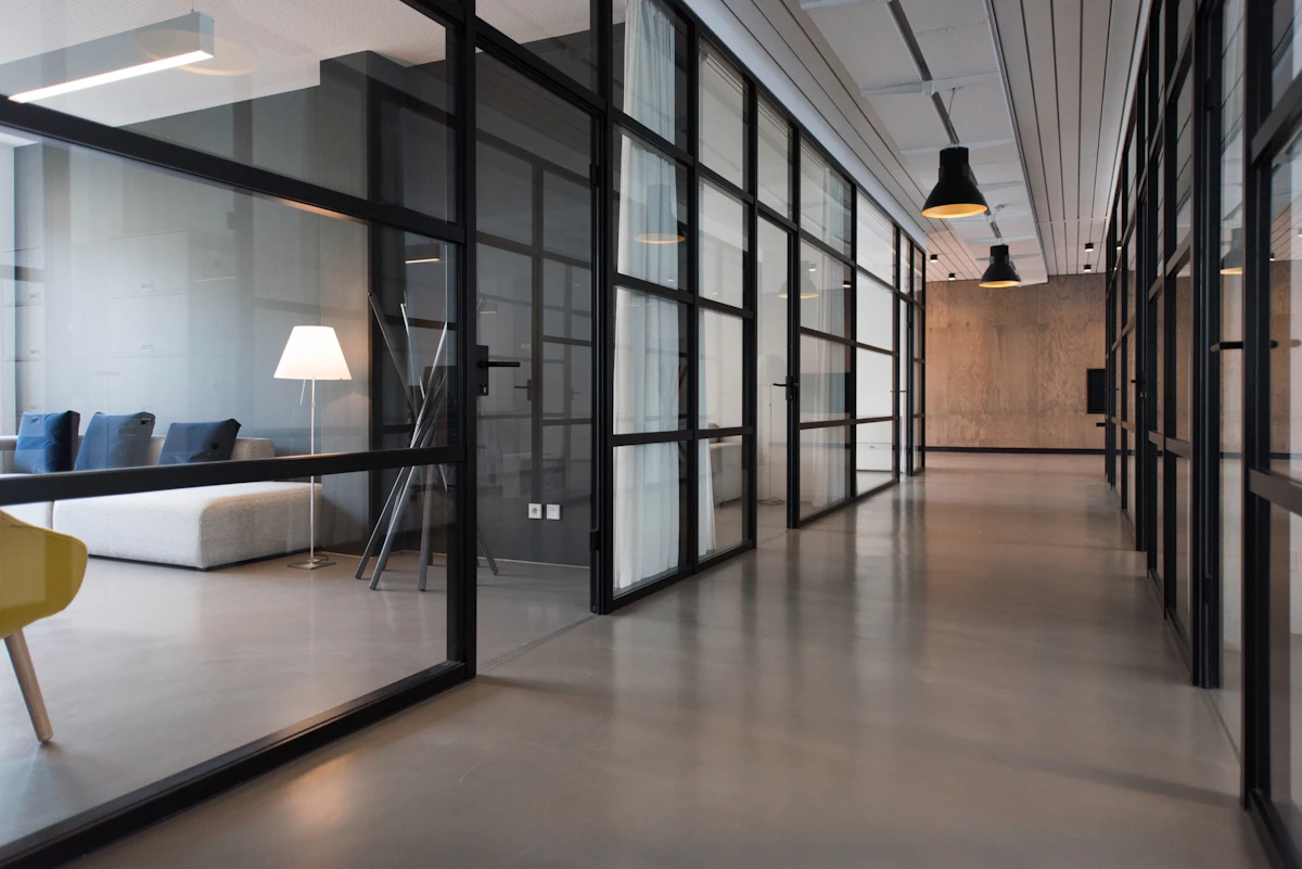 Contemporary workspace with large windows and greenery